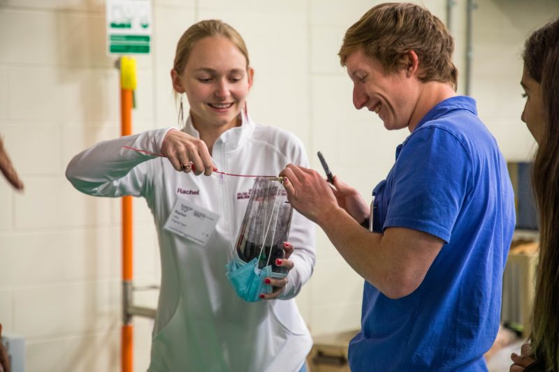 Rachel Lake, Virginia Tech Biological Systems Engineering Ambassador and Student, working on an experiment with another student at the Virginia Tech Southeastern ASABE Rally in 2022