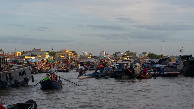 Image of floating market on the Mekong River in Vietnam.